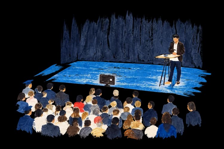 A small painted graduation stage and audience.
